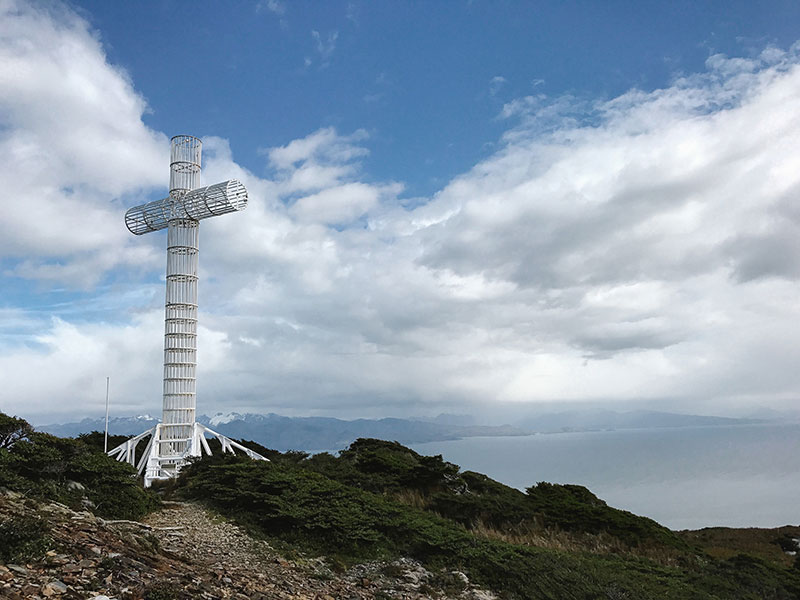 Cross of the Seas at Cabo Froward, the southernmost point of the American continent, overlooking the Strait of Magellan and the Patagonian landscape