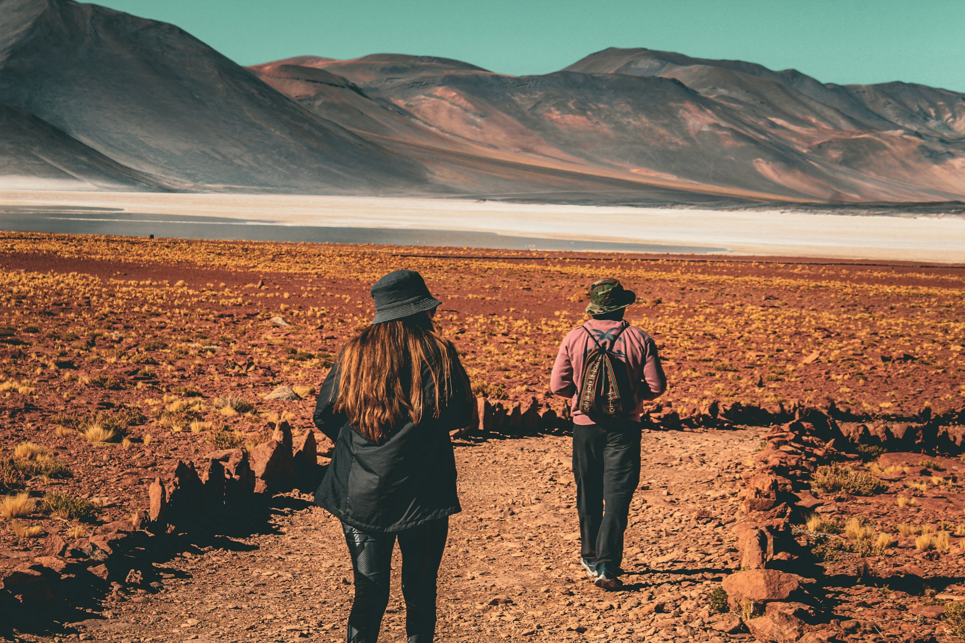 Couple walking through the Atacama Desert during a romantic excursion in San Pedro de Atacama.