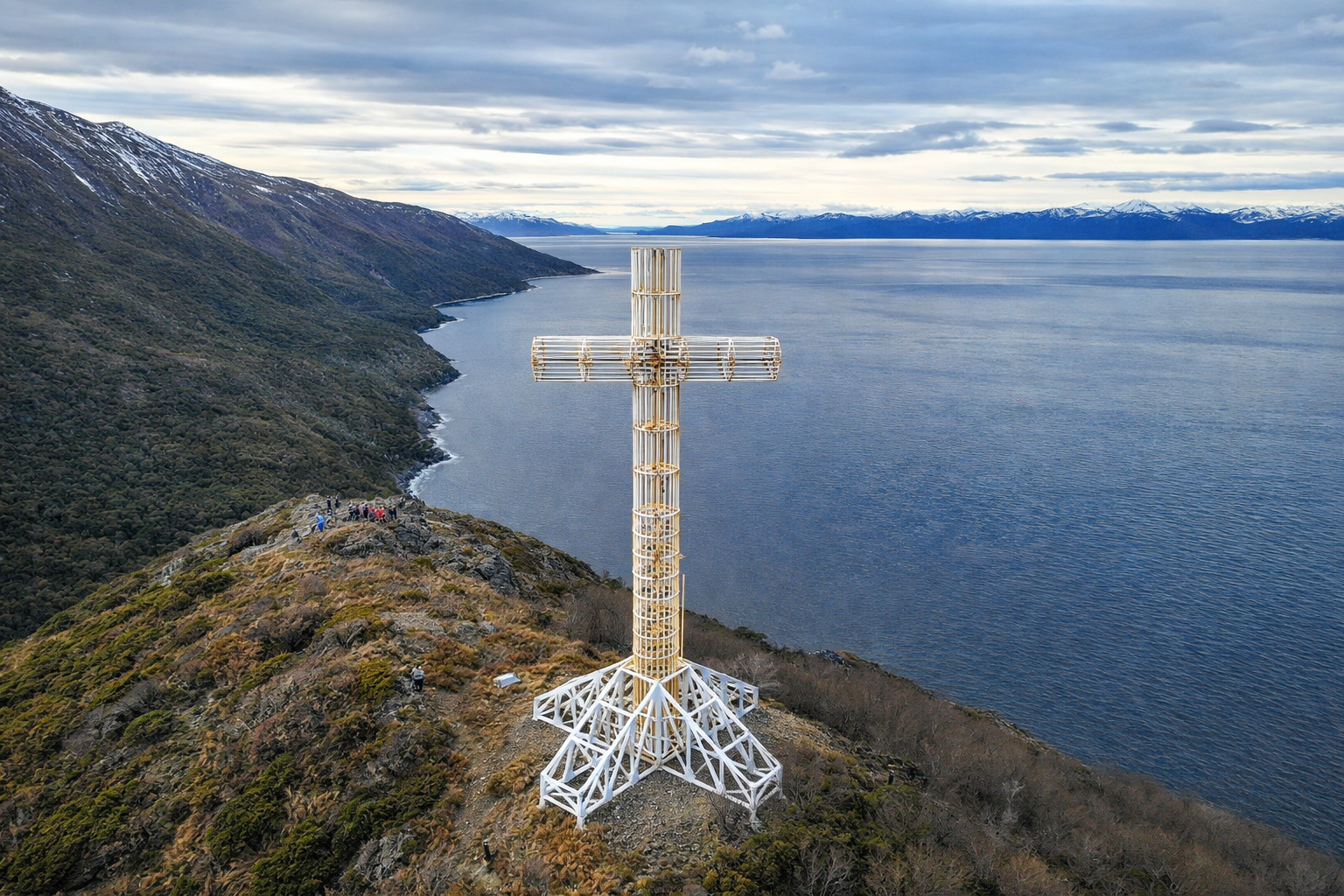 Aerial view of the Cross of the Seas at Cabo Froward, Chilean Patagonia, with the Strait of Magellan in the background and subantarctic vegetation around.